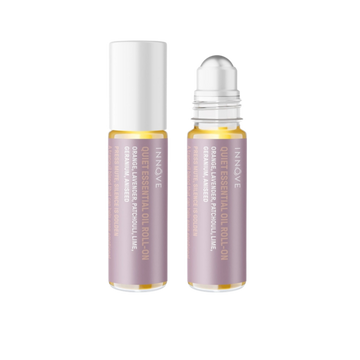 Two essential oil roller bottles with purple innove quiet essential oil roll on