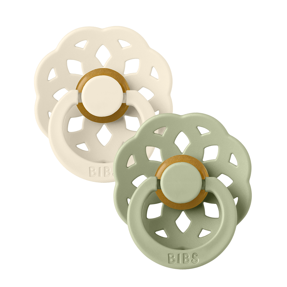 Set of two BIBS Boheme pacifiers featuring sage and vanilla colours, flower-style silicone shields, and ring handles—premium baby soothers for newborns and infants. Size one, Round.