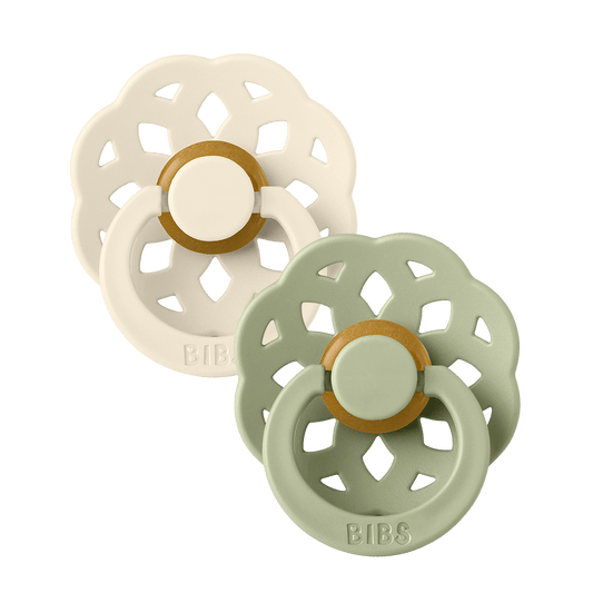 Set of two BIBS Boheme pacifiers featuring sage and vanilla colours, flower-style silicone shields, and ring handles—premium baby soothers for newborns and infants. Size one, Round.