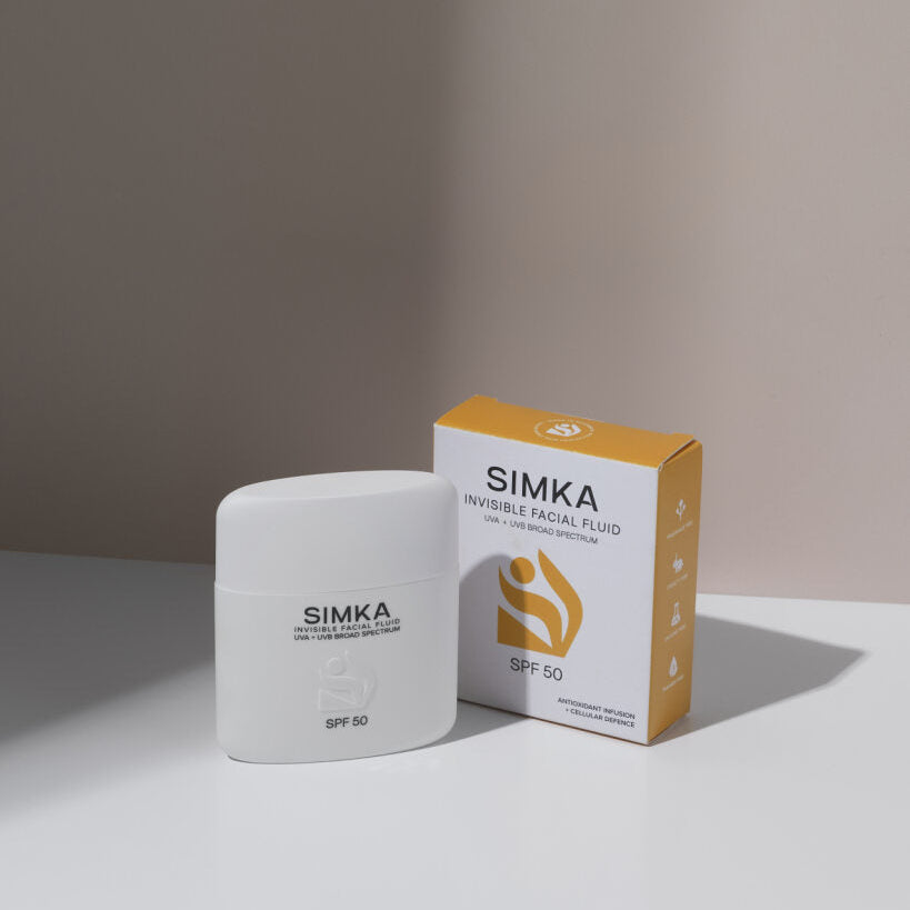 Simka sunscreen and packaging on a neutral background
