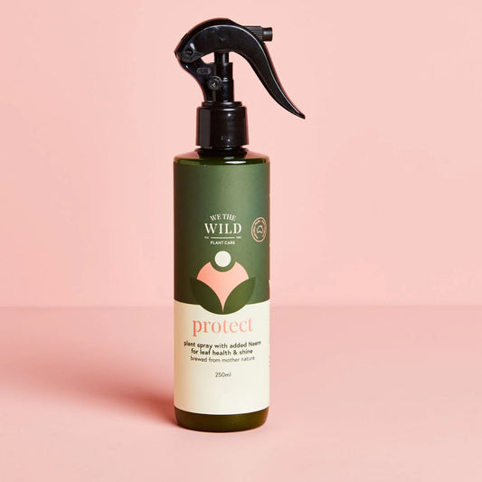 Bottle of 'We the Wild' Protect Organic Plant Spray with Neem Oil spray bottle  on a pink background 250ml