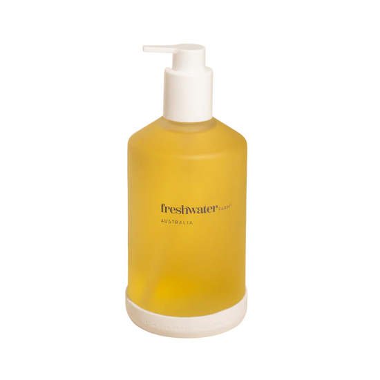 Yellow Freshwater bottle with pump dispenser on a white background