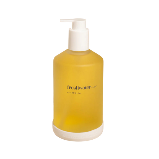 Yellow Freshwater bottle with pump dispenser on a white background