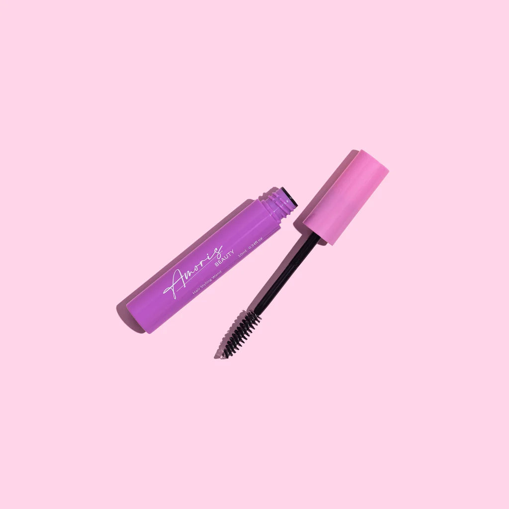 Pink amoris beauty hair styling wand on a pink background