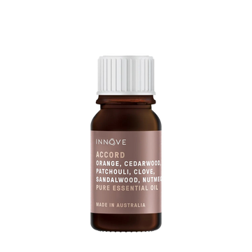 10mls Essential oil bottle named Accord with orange, cedarwood, patchouli, clove, sandalwood and nutmeg with a white cap on a Transparent background