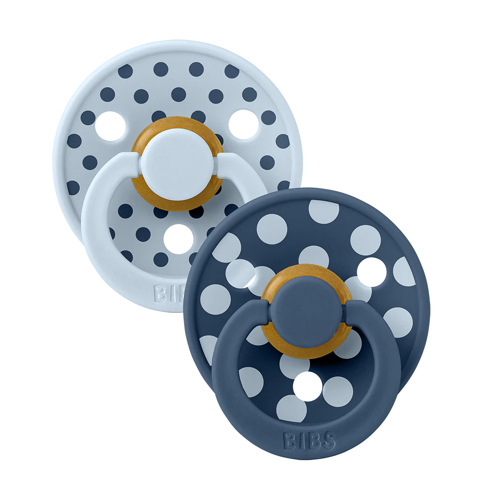 Two baby pacifiers with polka dot design navy blue and light blue