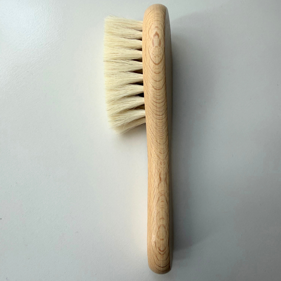 Baby wooden brush baby on grey background