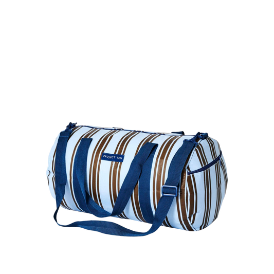 Striped duffel bag with blue handles. Barrel Bag – Oxford Stripe blue and brown