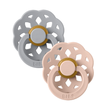 Set of two BIBS Boheme pacifiers featuring cloud and blush colors, flower-style silicone shields—premium baby soothers for newborns and infants. Round, size one.