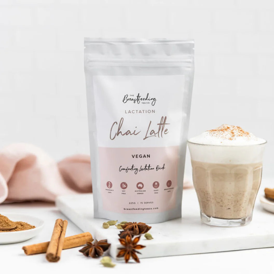 Bag of lactation Chai Latte powder with a glass of Chai Latte on a white background from the breastfeeding tea co.