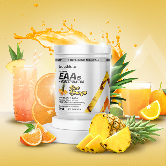 Top Athlete EAA + electrolytes supplement container with orange and pineapple elements on a yellow background