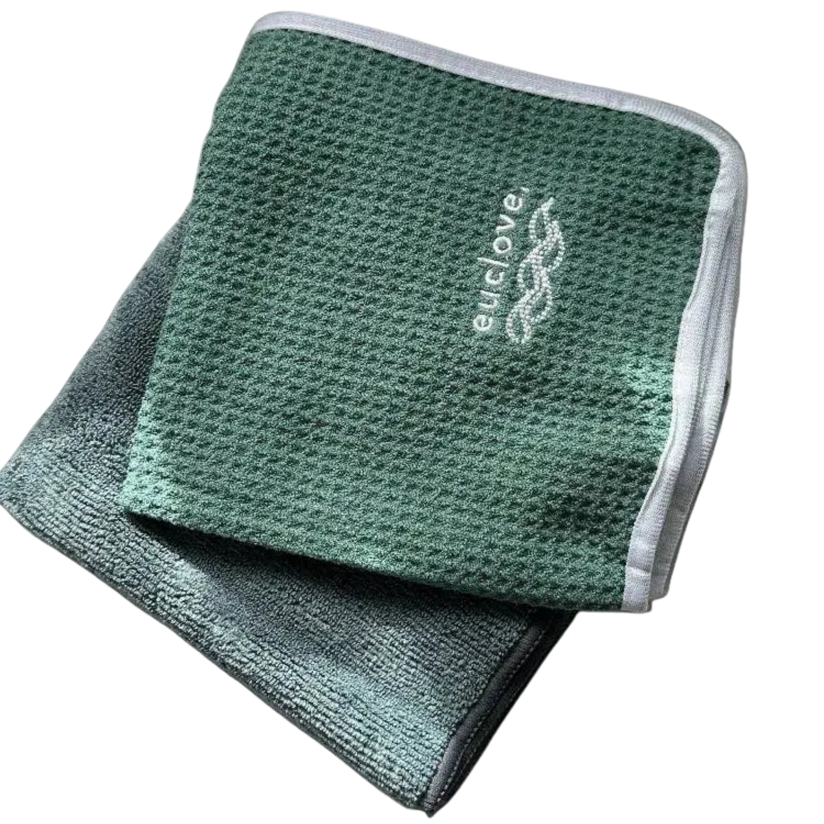 Two folded textured microfiber cloths in green tones, with one placed on top of the other. The top cloth is a medium sage green with a white embroidered 'euclove' logo, and the bottom cloth is a darker gray-green.