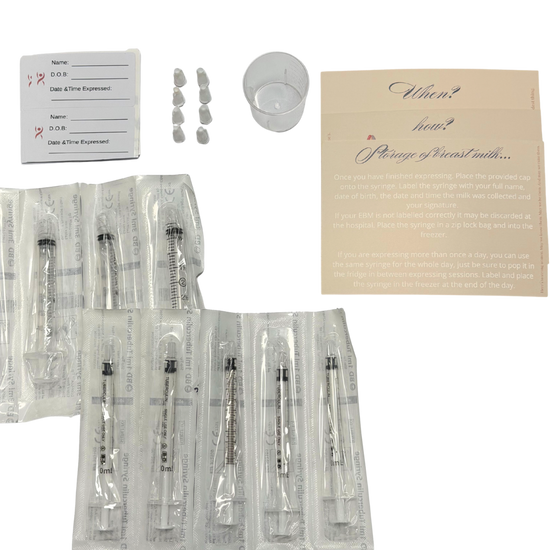 syringes, labels, caps, cup and instruction cards on a white background