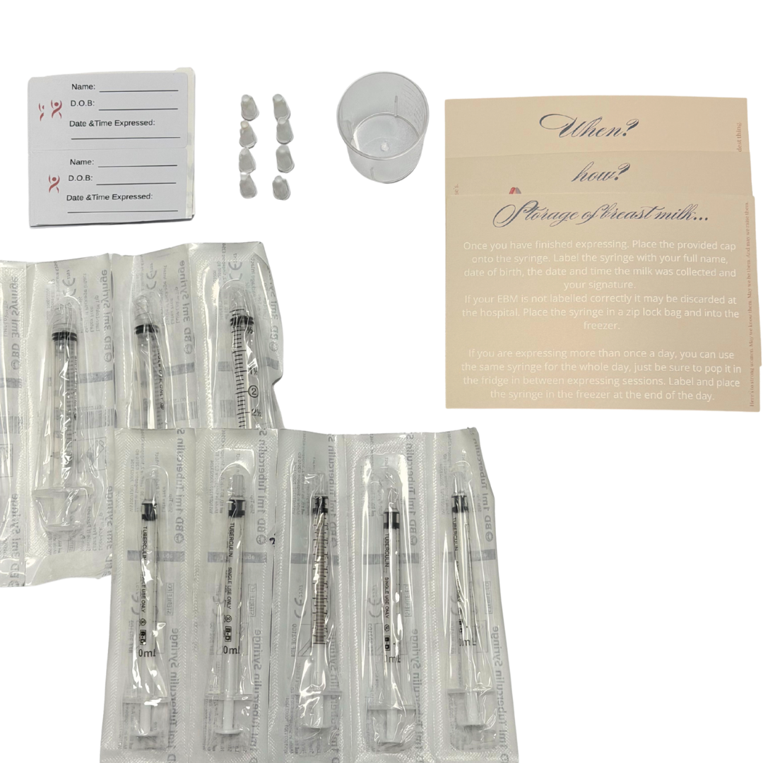 syringes, labels, caps, cup and instruction cards on a white background