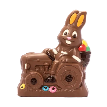 Chocolate bunny riding a tractor with colorful candies on a white background