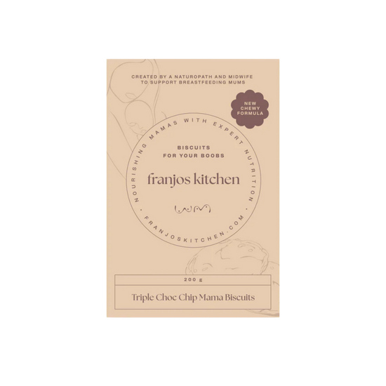 A package of Franjos Kitchen Triple Choc Chip Mama Biscuits. The packaging is a light tan/beige color with elegant black typography and subtle line-art illustrations of a woman holding a teacup and a chocolate chip cookie.