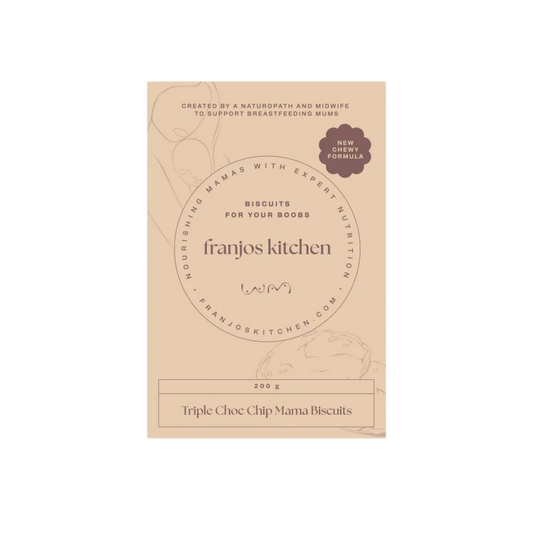 A package of Franjos Kitchen Triple Choc Chip Mama Biscuits. The packaging is a light tan/beige color with elegant black typography and subtle line-art illustrations of a woman holding a teacup and a chocolate chip cookie.