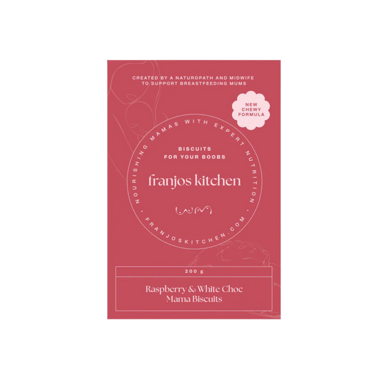 A rectangular pink package for Franjos Kitchen 'Raspberry & White Choc Mama Biscuits' The package features white text and a small white cloud badge indicating a 'New Chewy Formula'.