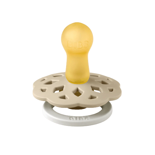 Set of two BIBS Boheme pacifiers featuring vanilla colour, flower-style silicone shields, and white ring handles—premium baby soothers for newborns and infants. Glow in the dark, round, size one.