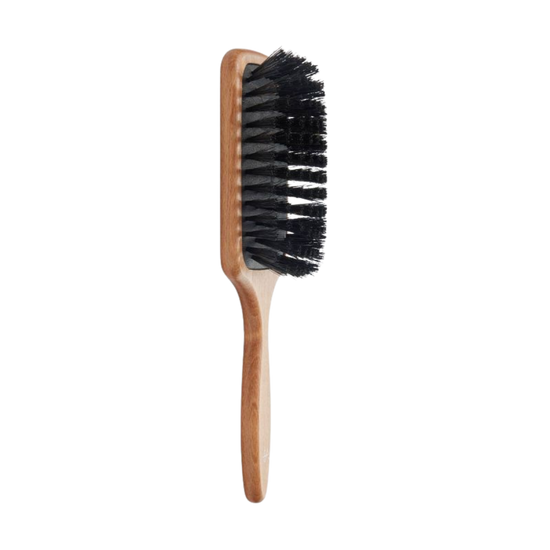 Hairbrush with wooden handle and black boar bristles