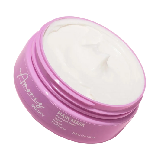 Pink amoris hair mask jar with on a pink background