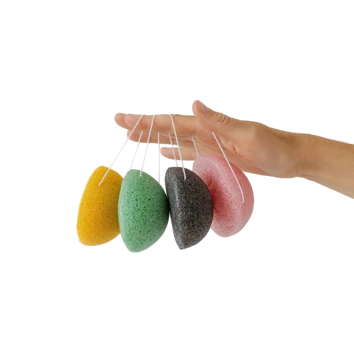 Four colorful konjac sponges hanging from a string against a white background