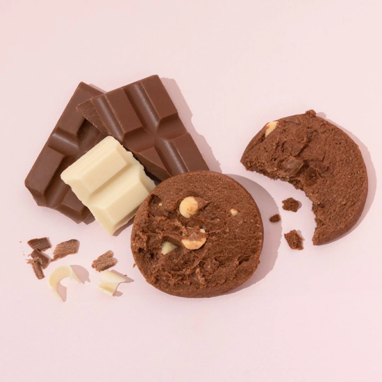 made to milk Chocolate cookies and a chocolate bar on a pink background