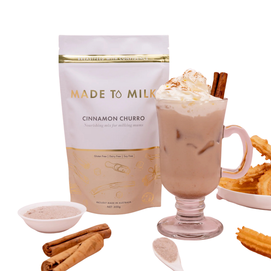 Made to Milk cinnamon churro flavor package with a glass of hot chocolate, whipped cream, and cinnamon sticks.