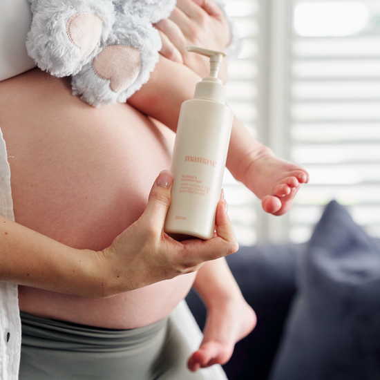 Pregnant mum holding a pump bottle of bubbas moisturiser 250ml with a baby's feet visible