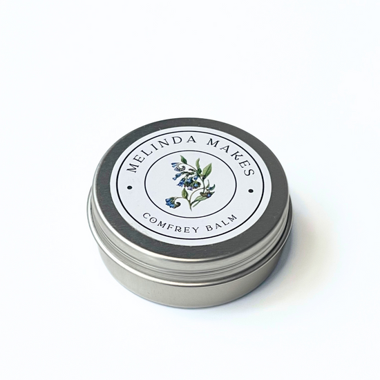Tin of Melinda Makes Comfrey Balm on a white background