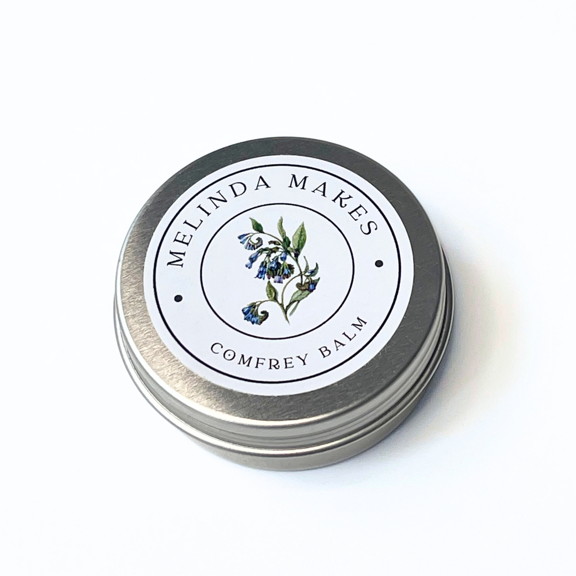 Tin of Melinda Makes Comfrey Balm on a white background