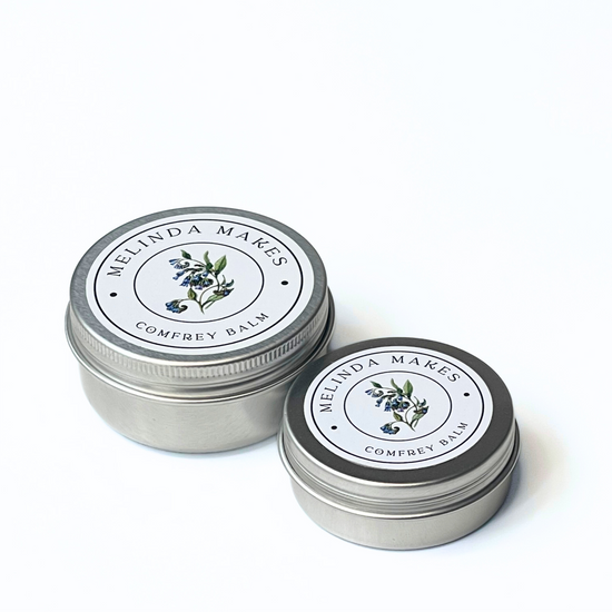 Both size tins of Melinda Makes Comfrey Balm on a white background