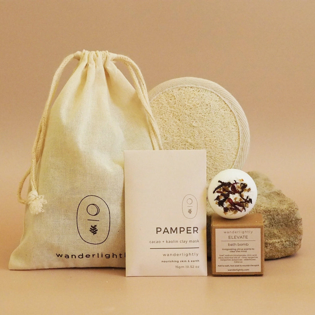 Pamper product set with drawstring bag, soap, and boxes.
