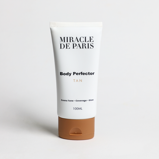 Tube of Tan Miracle de Paris Body Perfector on a light gray background