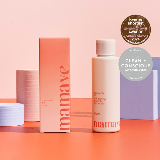 Mamave Mumma's Pregnancy and Postpartum Oil  bottle product and packaging on a pink background with awards displayed beauty shortlist mamma & baby awards editors choice 2024 and pregnancy clean and conscious award 2024 silver winner.