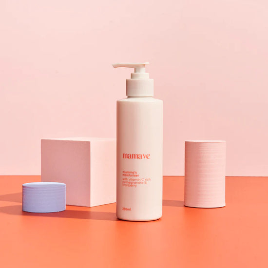 White bottle with pump labeled 'mamave'  mummas moisturiser on a pink and orange gradient background