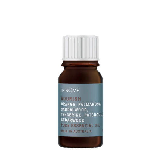 10mls Essential oil bottle named Nourish with orange, palmarosa , sandalwood, tangerine, patchouli and cedarwood and ylang ylang with a white cap on a Transparent background