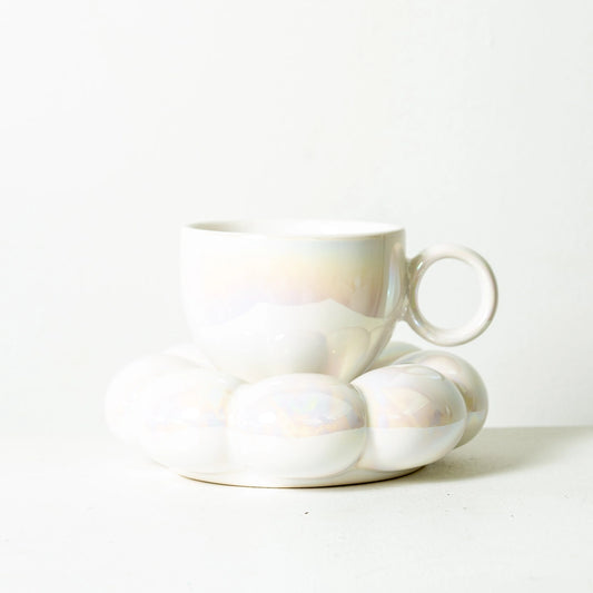 White ceramic cup and saucer on a white background