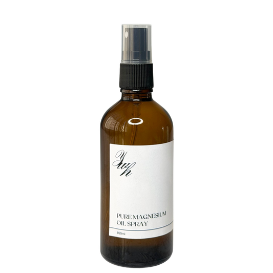 Brown glass spray bottle labeled 'Pure Magnesium Oil Spray' 