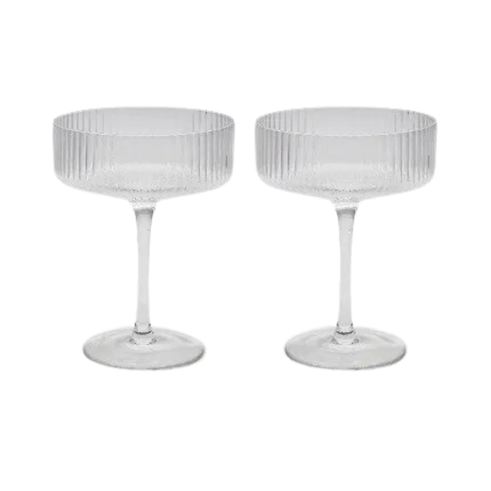 Set of two ribbed coupe cocktail glasses on a white background