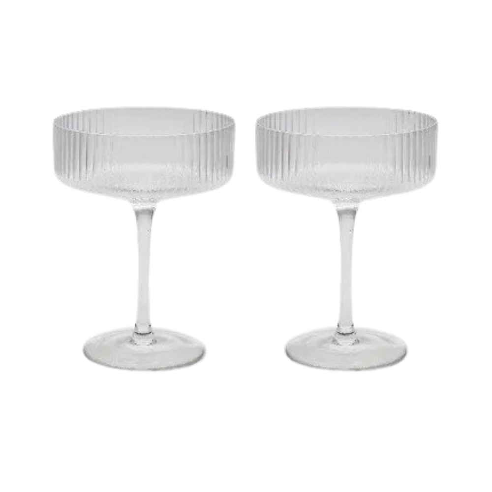 Set of two ribbed coupe cocktail glasses on a white background