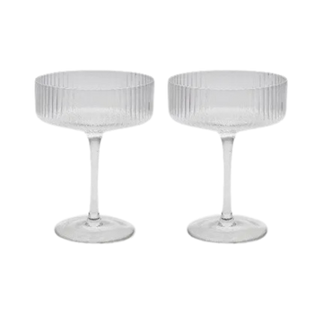 Set of two ribbed coupe cocktail glasses on a white background