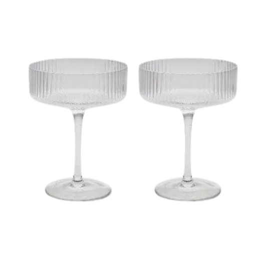 Set of two ribbed coupe cocktail glasses on a white background