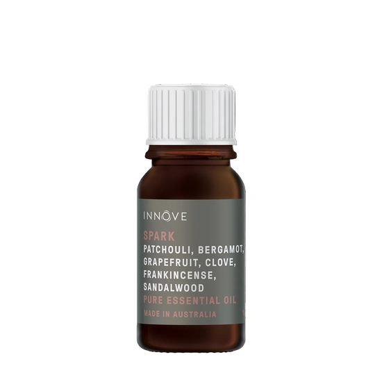 10mls Essential oil bottle named Spark with patchouli, bergamot, grapefruit, clove, frankincense and sandalwood with a white cap on a Transparent background