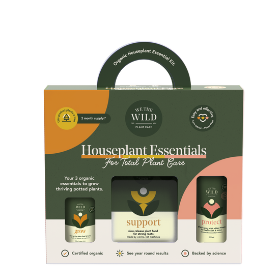 We the Wild Houseplant Essentials packaging with three small bottles on a pink background