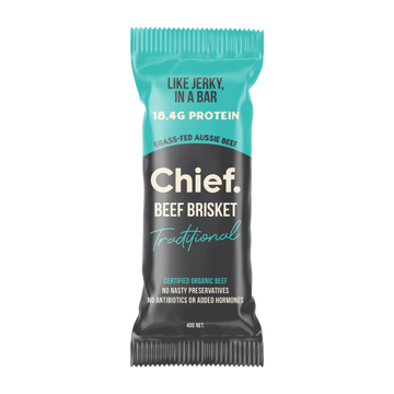 A single Chief Beef Brisket Traditional protein bar wrapper, featuring a black and teal design with white text.