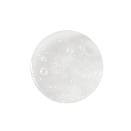 Small round sample of shampoo with small bubbles on a white background