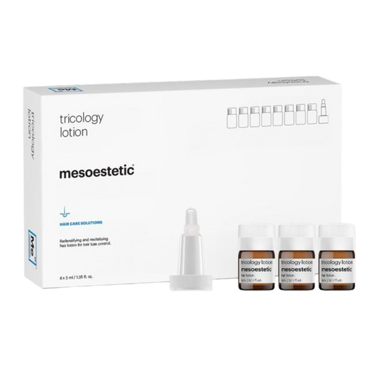 Mesoestetic tricology lotion packaging with bottles on a white background