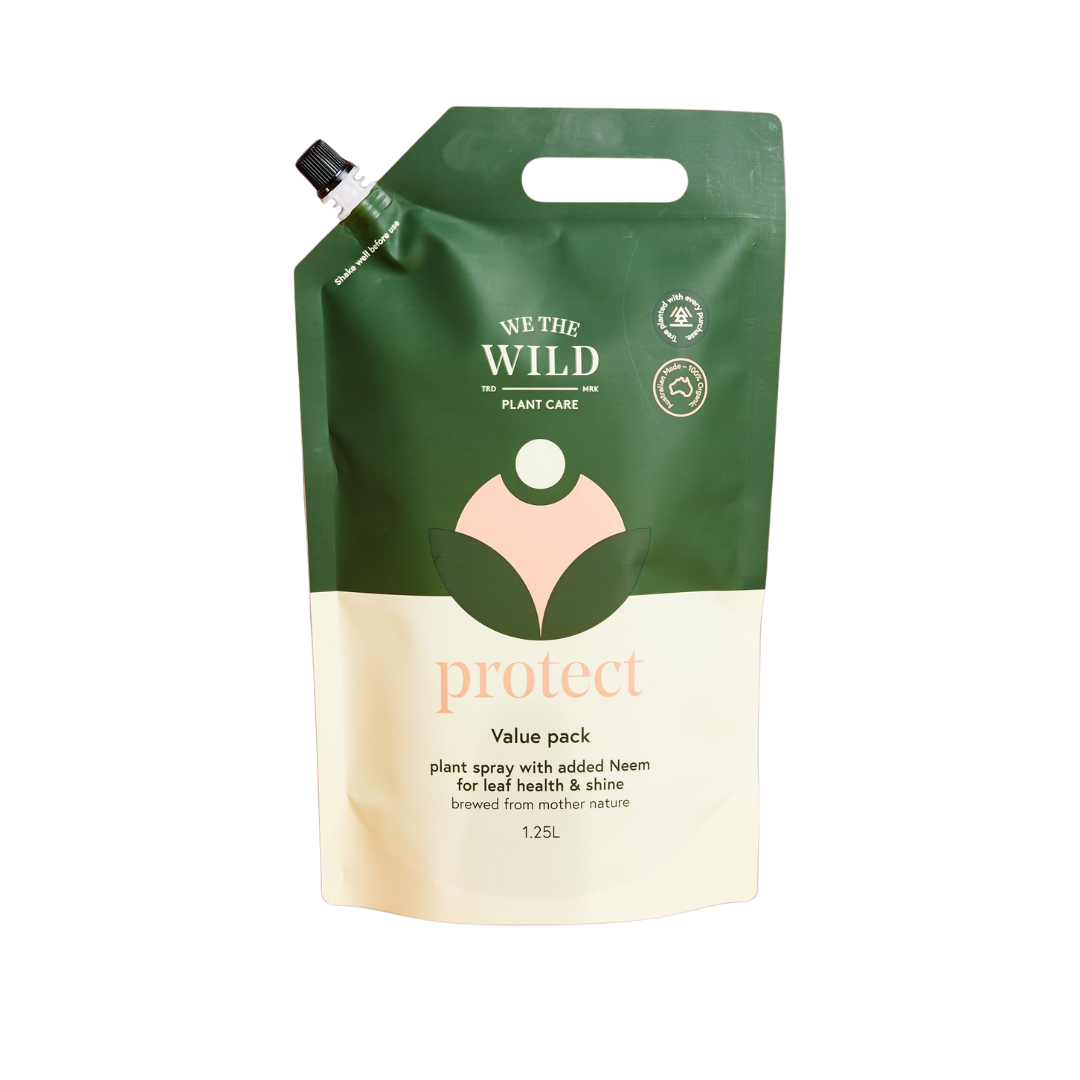 Green and beige plant care product packaging with 'We the Wild' branding on a white background.