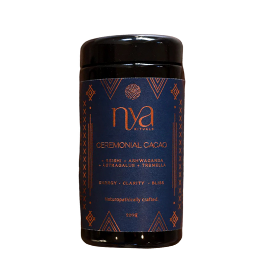 Nya Ceremonial cacao container with blue label and black lid on a transparent background